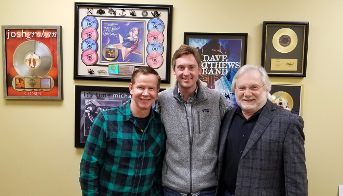 Craig Mundy, Christian Morgan and Dan Vallie pose for a picture in Vallie's office.