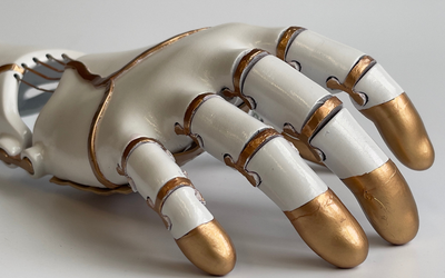Prosthetic hand close up white and gold
