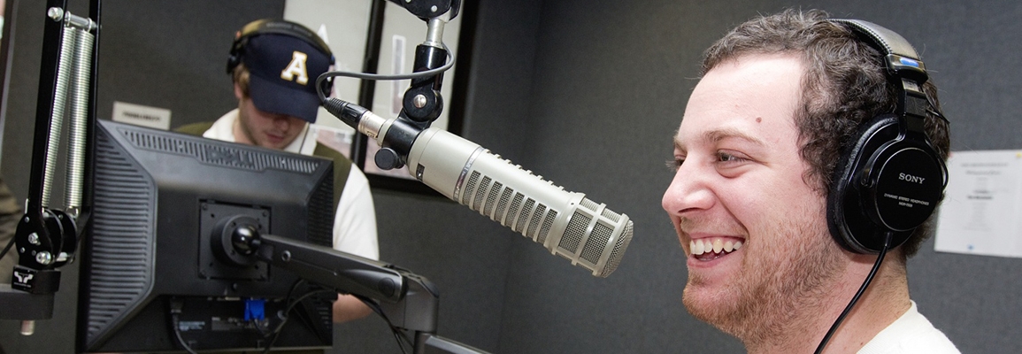 A communicaton student on air in the studio