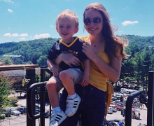 Karah Smith, a senior communication, public relations major from Winston-Salem, holds her son, Emerson, who wears Appalachian’s black and gold. Emerson is one of nearly 70 children served by Appalachian’s Child Development Center in fall 2019. Photo submitted