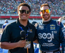 Noah Cornelius (left) interviews Kaz Grala, driver of the No. 50 Segi.TV Chevrolet Camaro for Floyd Mayweather’s The Money Team Racing