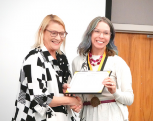 App State professor Jeana Klein accepts her awards from Chancellor Sheri Everts