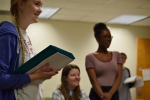 Three students rehearse for an upcoming performance.