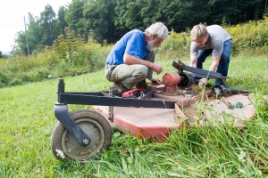 Student and faculty member work on the farm