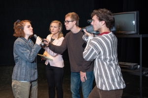 Four theatre students rehearse