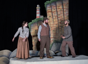 Three students during a performance of "Selkie: Between Land and Sea"