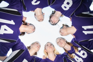 Girls in a soccer huddle